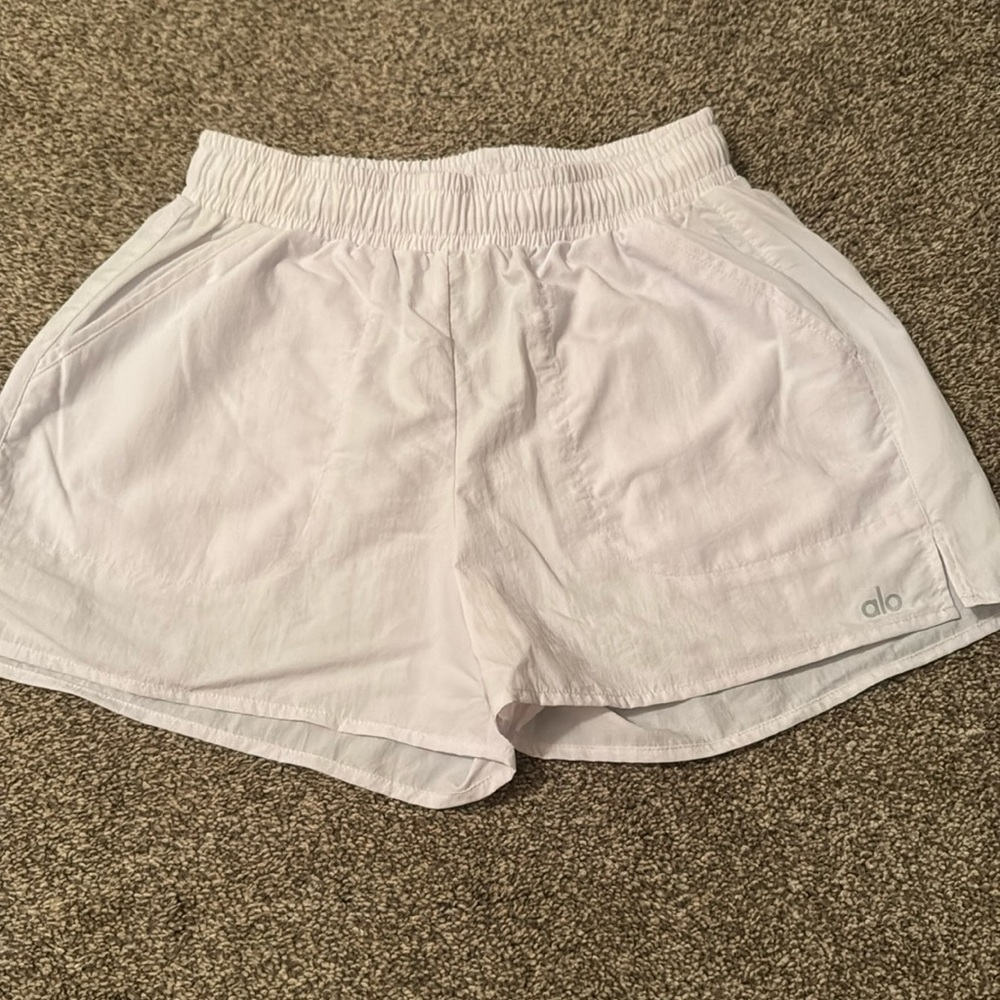 Alo yoga Alumni shorts. Size small in white. Wore a few times. It is big on me.